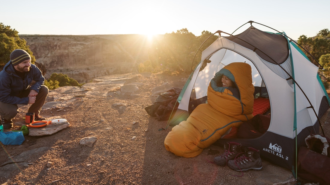 two campers in a tent