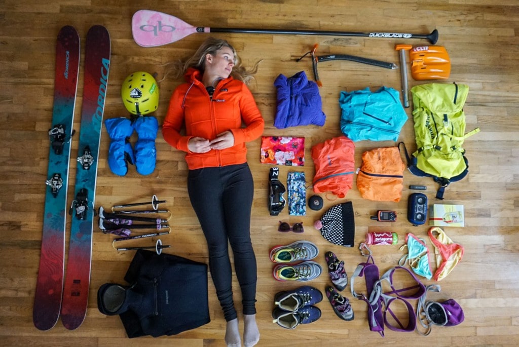 Caroline Gleich laying around all the gear she's about to pack for a ski trip.