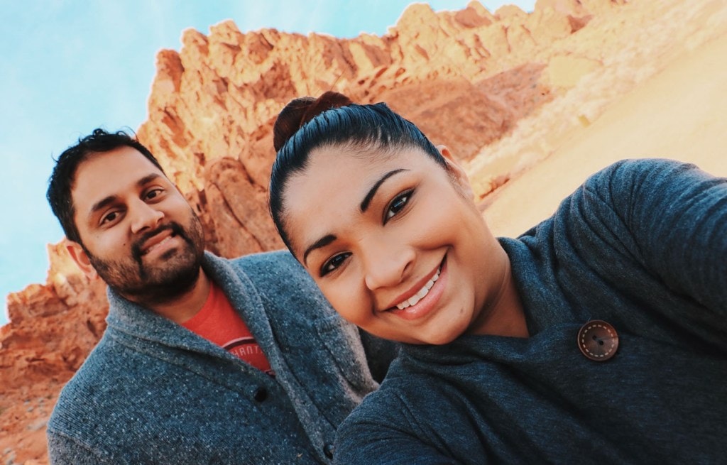 Couple of hikers in front of mountain