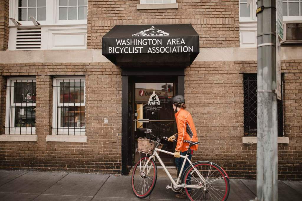 Person walking bike into WABA