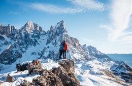 Two hikers hug on a big mountain