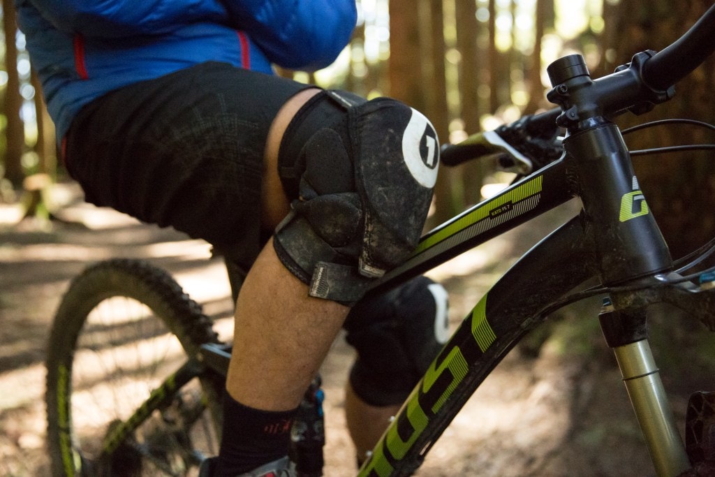 a mountain biker wearing knee pads