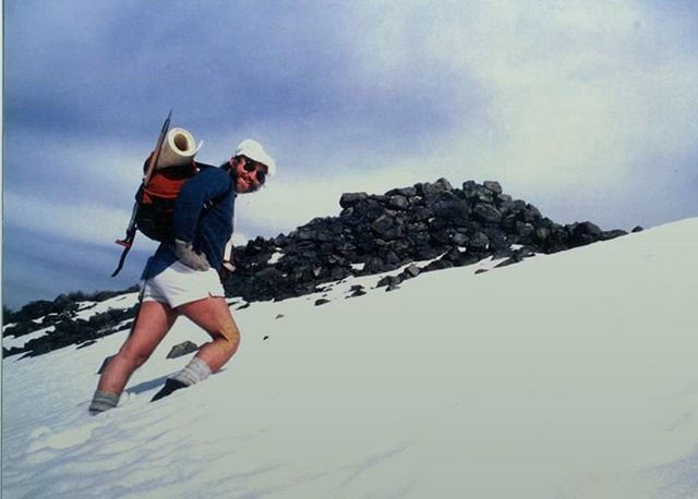 Dad hiking in short shorts on snow