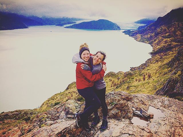 Two friends hugging outside