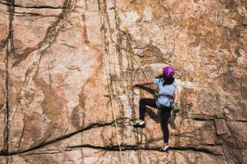 Woman top-rope climbing