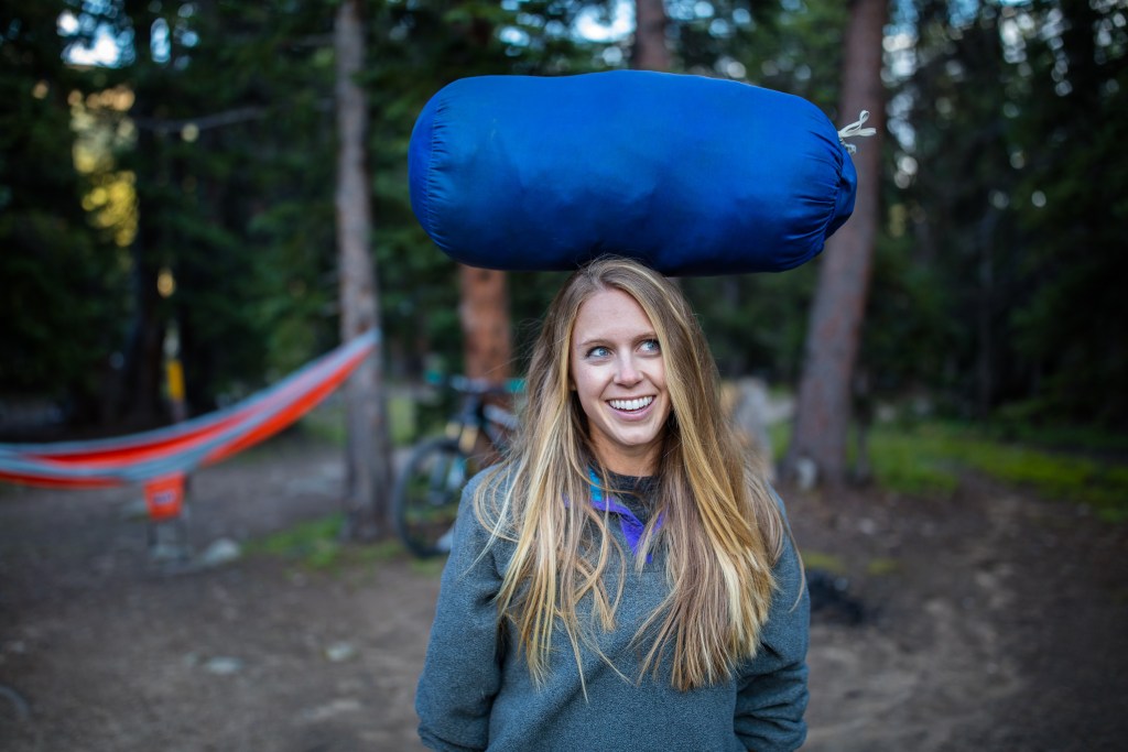 Whitney James with her beloved blue REI sleeping bag