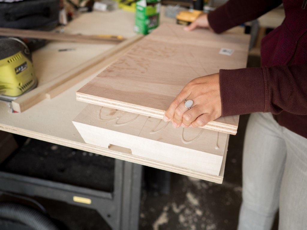 carefully line up a piece of ¾-in. plywood and lay it on the blocks