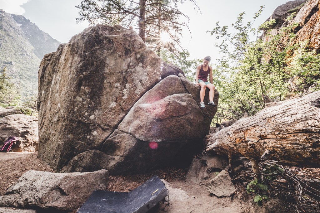 Edwards sitting atop a boulder