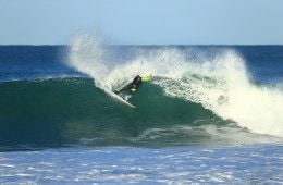 Peter Mel surfing a wave.