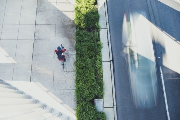 A cyclist biking alongside a highway