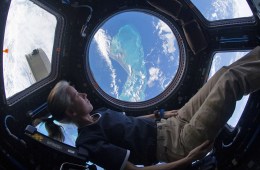 Shannon Walker, NASA astronaut, in the cockpit of a spaceship.