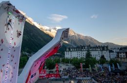 Maria Krasavina and Elena Remizova race up a steep climbing wall.