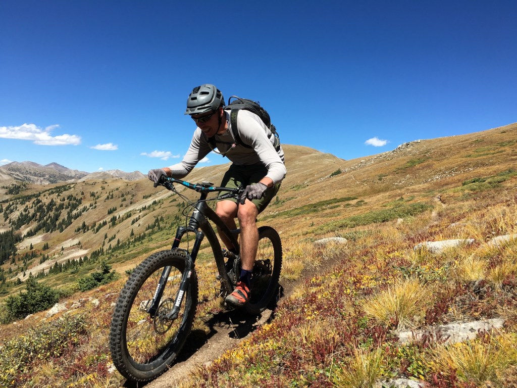 A mountain biker enjoying riding a trail. 