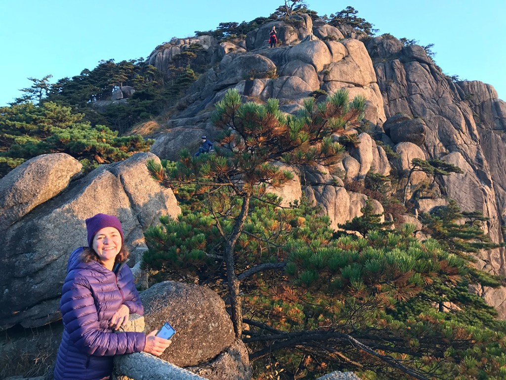 The author's mom enjoys the sunlight near the top of the Yellow Mountain.