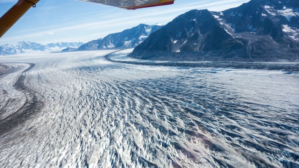 The massive glacier ice sheet of Wrangell St. Elias stretches into the horizon.