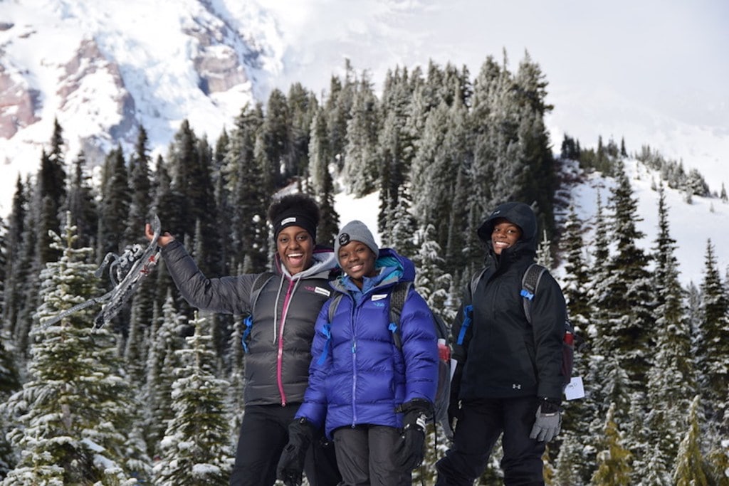 Three girls learn outdoor skills through a course from The Mountaineers in Seattle.