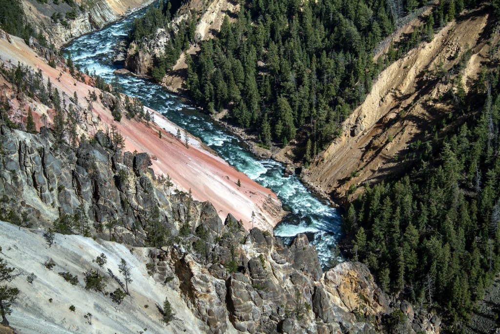 River shown far below the grey rocks.