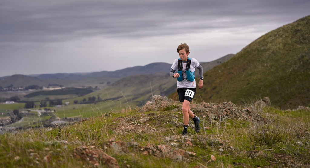 Sebastian Salsbury, now 11, in the midst of a trail running race.