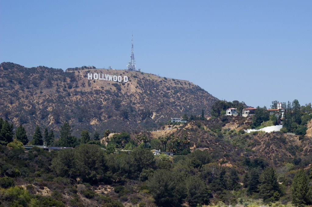 The Hollywood sign sits on the hillside over a Los Angeles neighborhood.