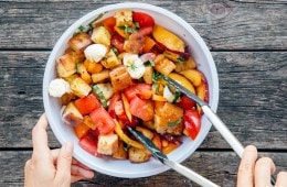 Stirring panzanella salad