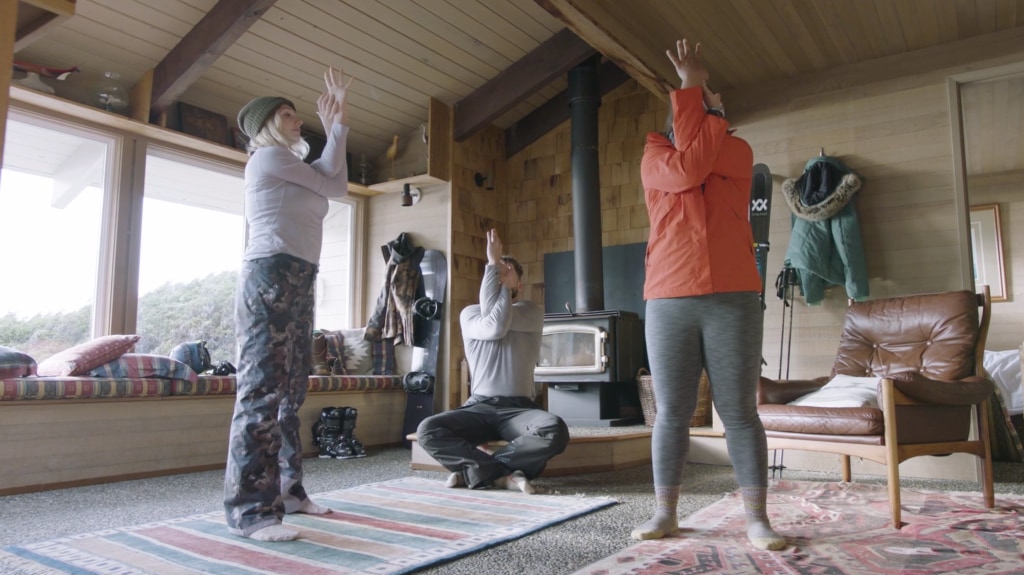 Corepower yoga instructors do an eagle arm stretch