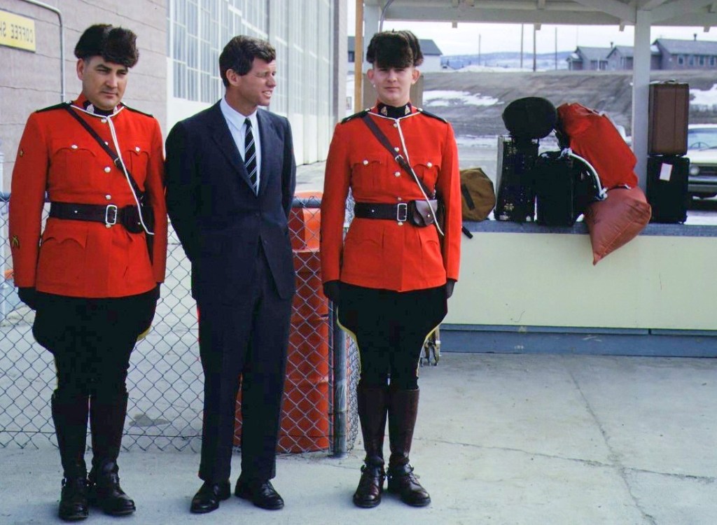 Robert Kennedy pauses with Canadian Mounted Police