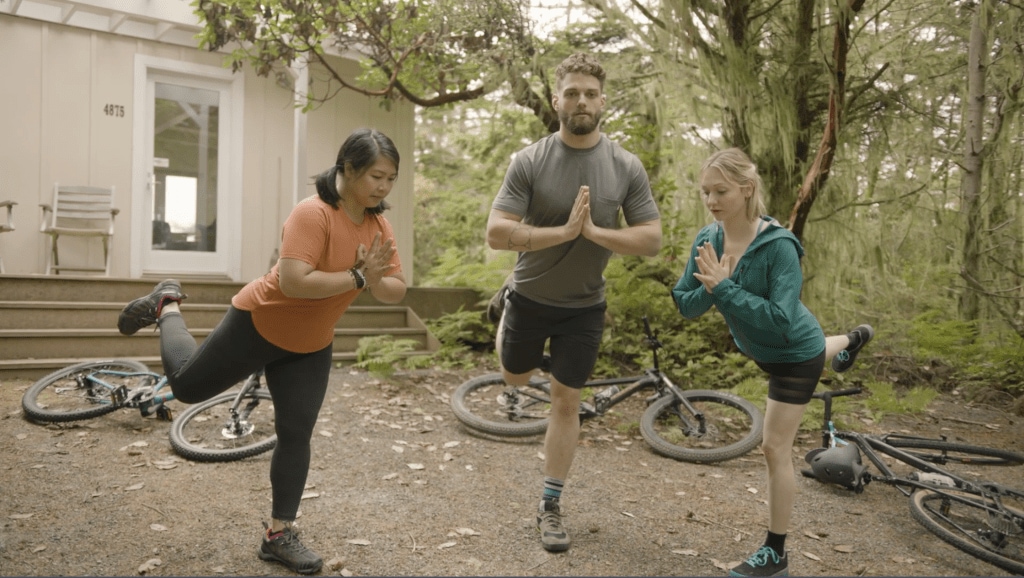 Corepower yoga instructors hold hands-free dancer