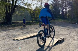 11-year-old on a bike going over a ramp