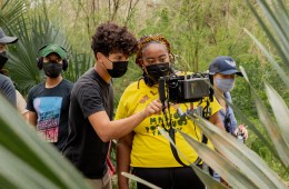 Angela Tucker looking at the camera while filming The Trees Remember.