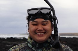 Person smiling with diving gear on.