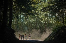 Izzy Sederbaum and friends bike on a trail