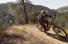 A person rides the new Co-op Cycles electric mountain bike DRT e3.1