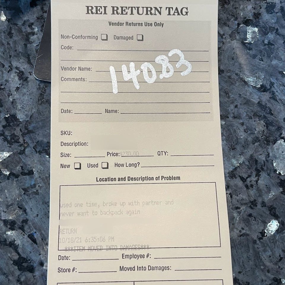 Return tag that reads: "used one time, broke up with partner and never want to backpack again"