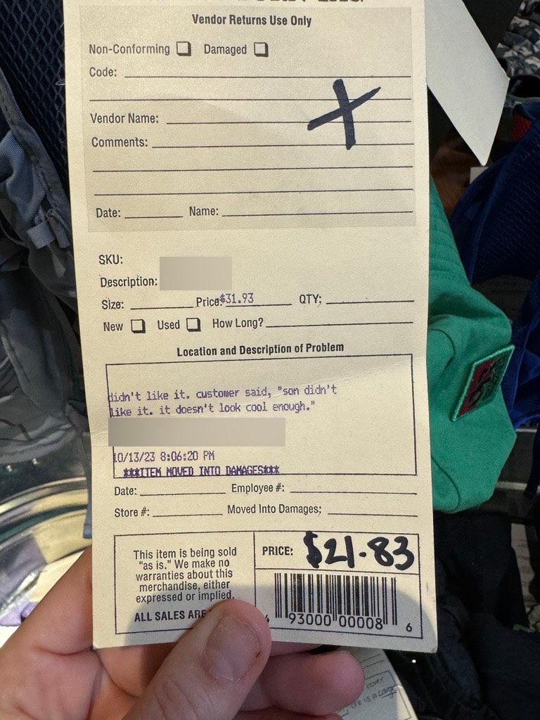 Return tag that reads: "didn't like it. customer said, 'son didn't like it. it doesn't look cool enough.'"