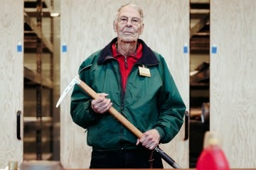 A person holds an ice axe