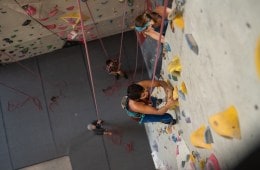 Two climbers on an indoor climbing wall