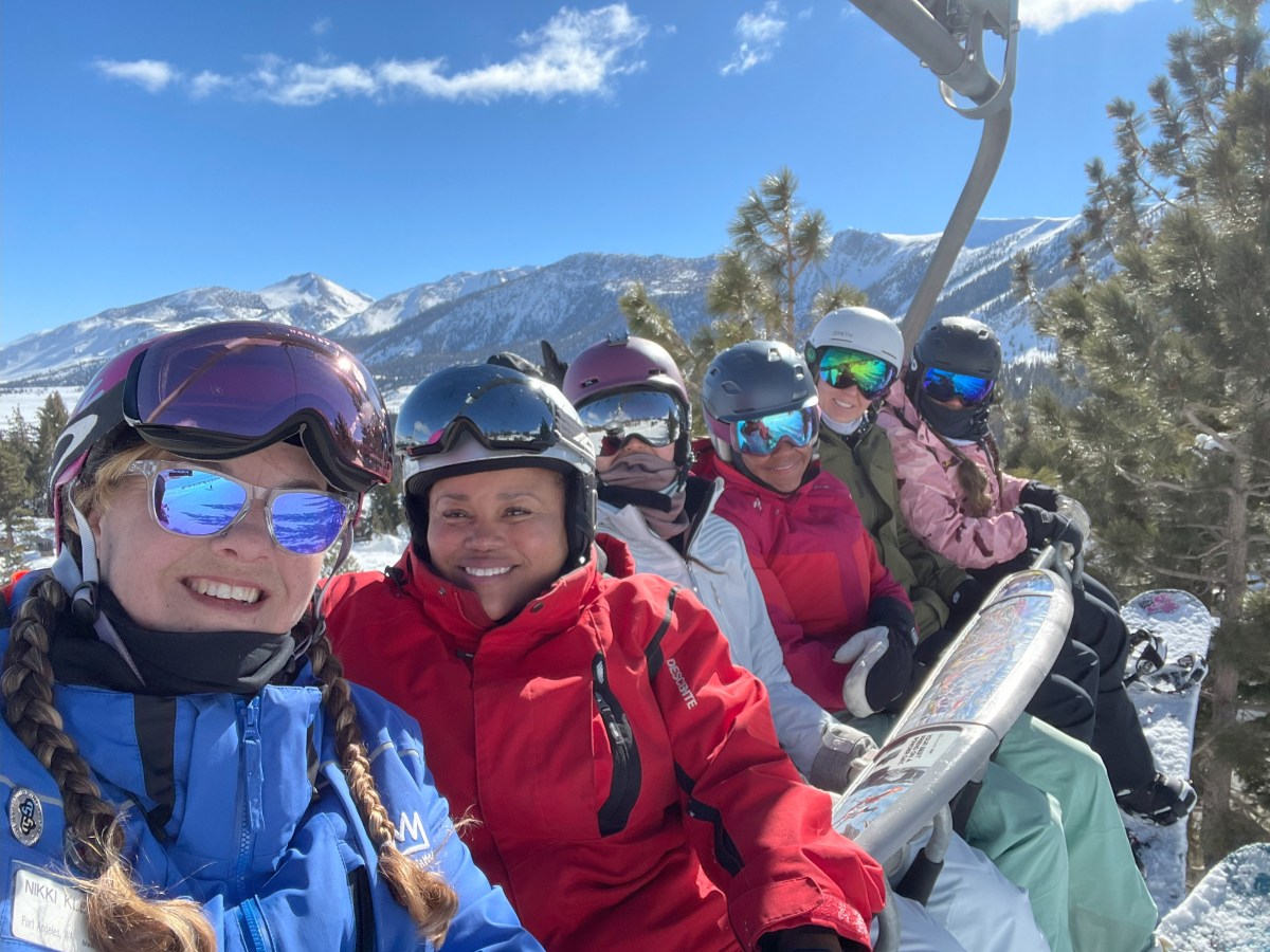 Photo of six people riding a ski lift