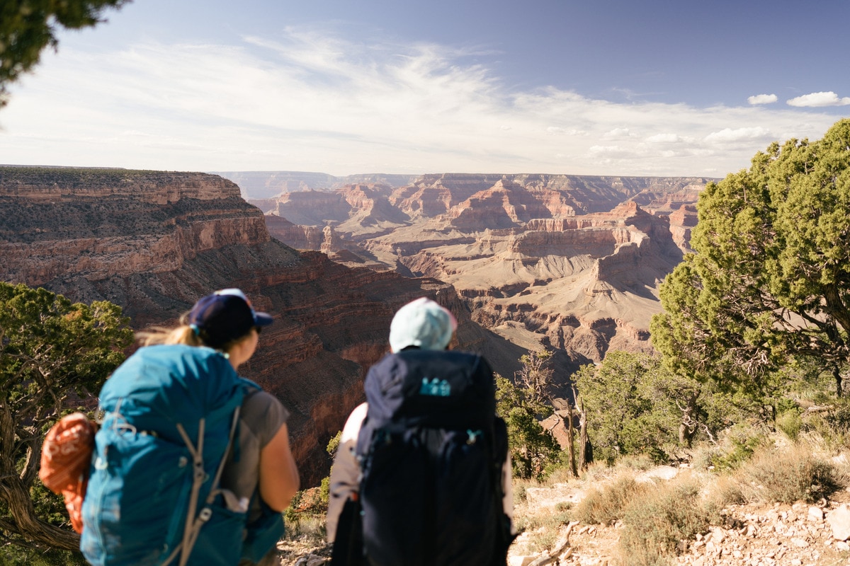 New friends celebrate an amazing journey backpacking the Grand Canyon.