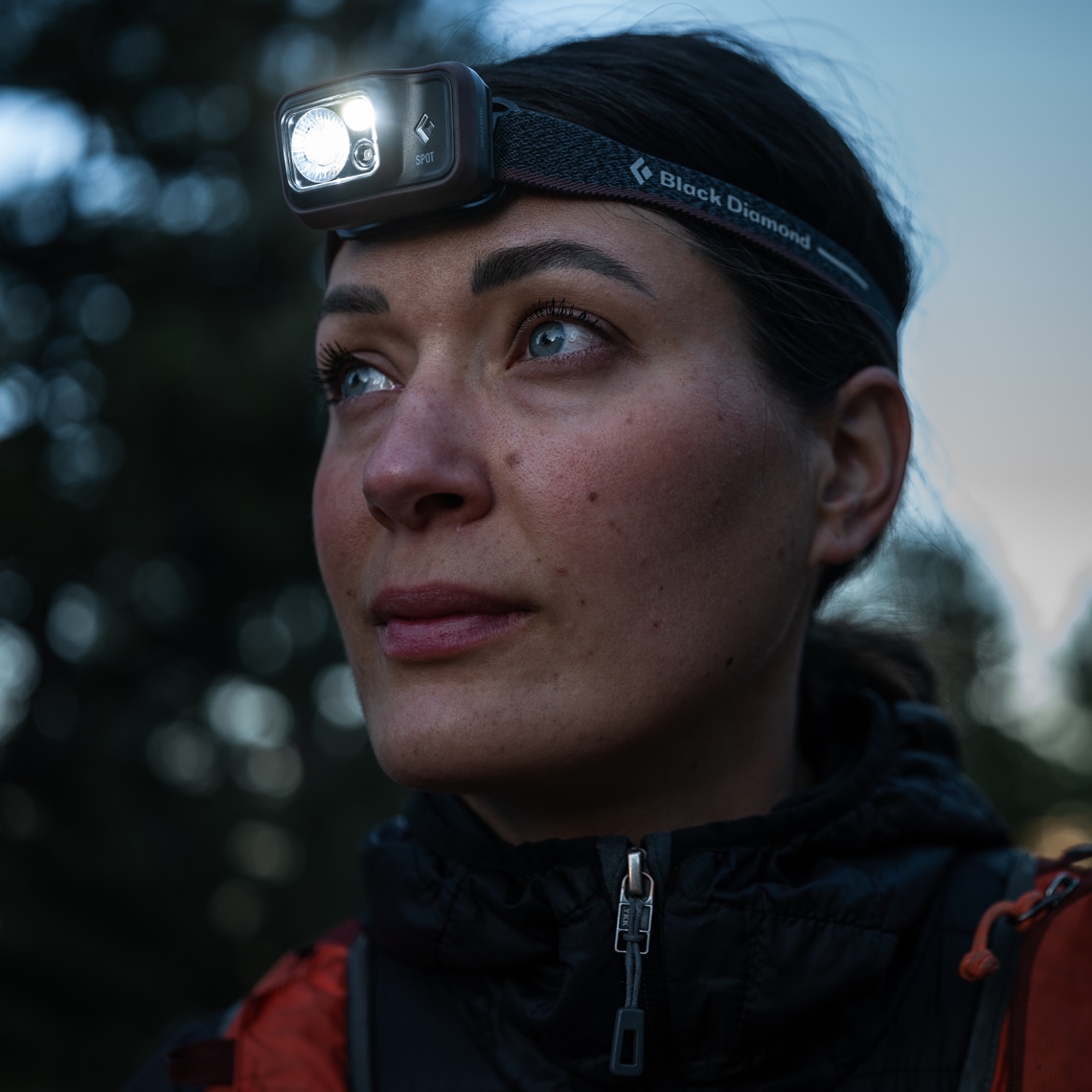 A hiker wears the Spot 400 headlamp