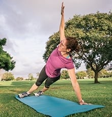 Woman in a side plank position