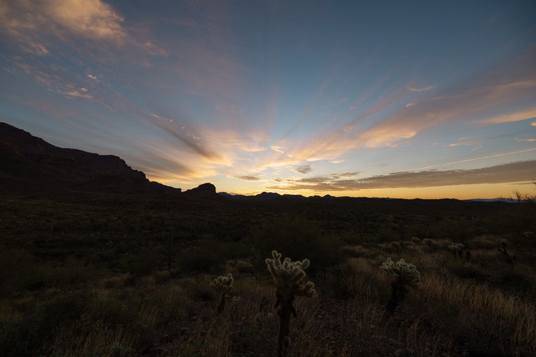 Sunset over a desert landscape with no people visible