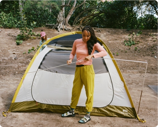 Campers setting up their tent.