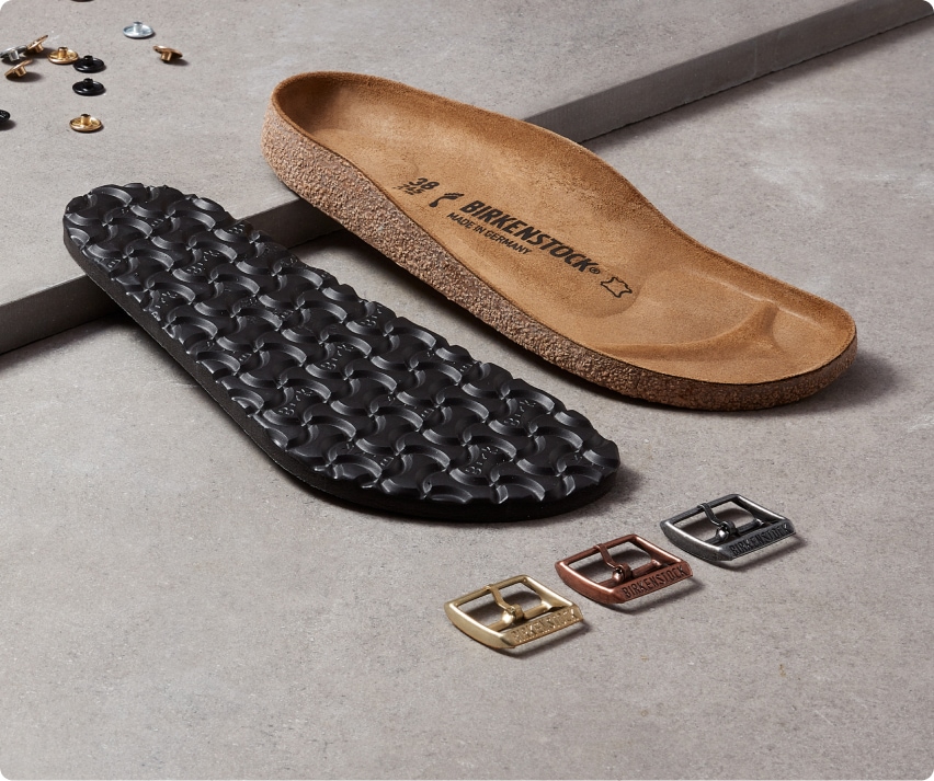 Deconstructed parts of a Birkenstock sandal.