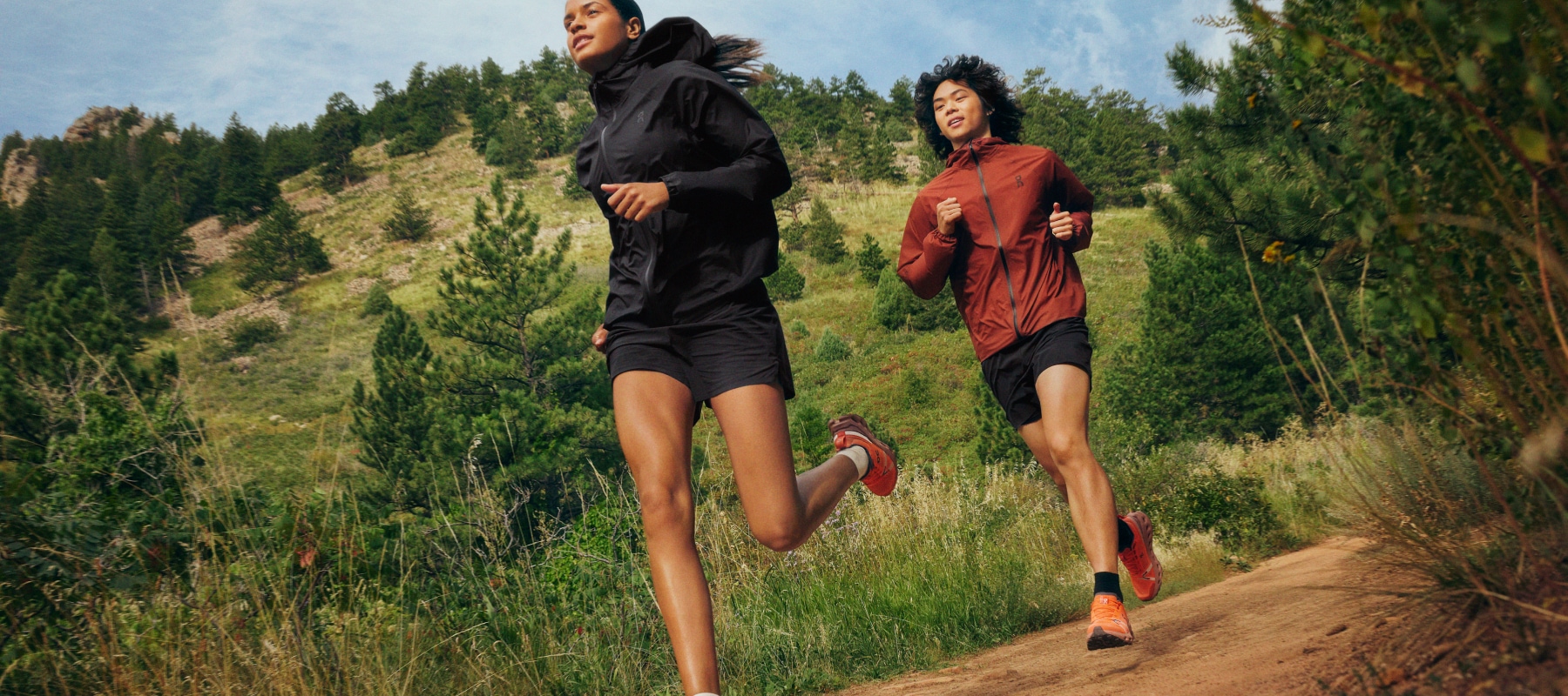 Two trail runners wearing On clothing and shoes.