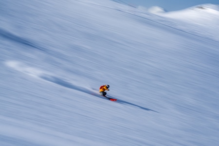 A skier speeds downhill