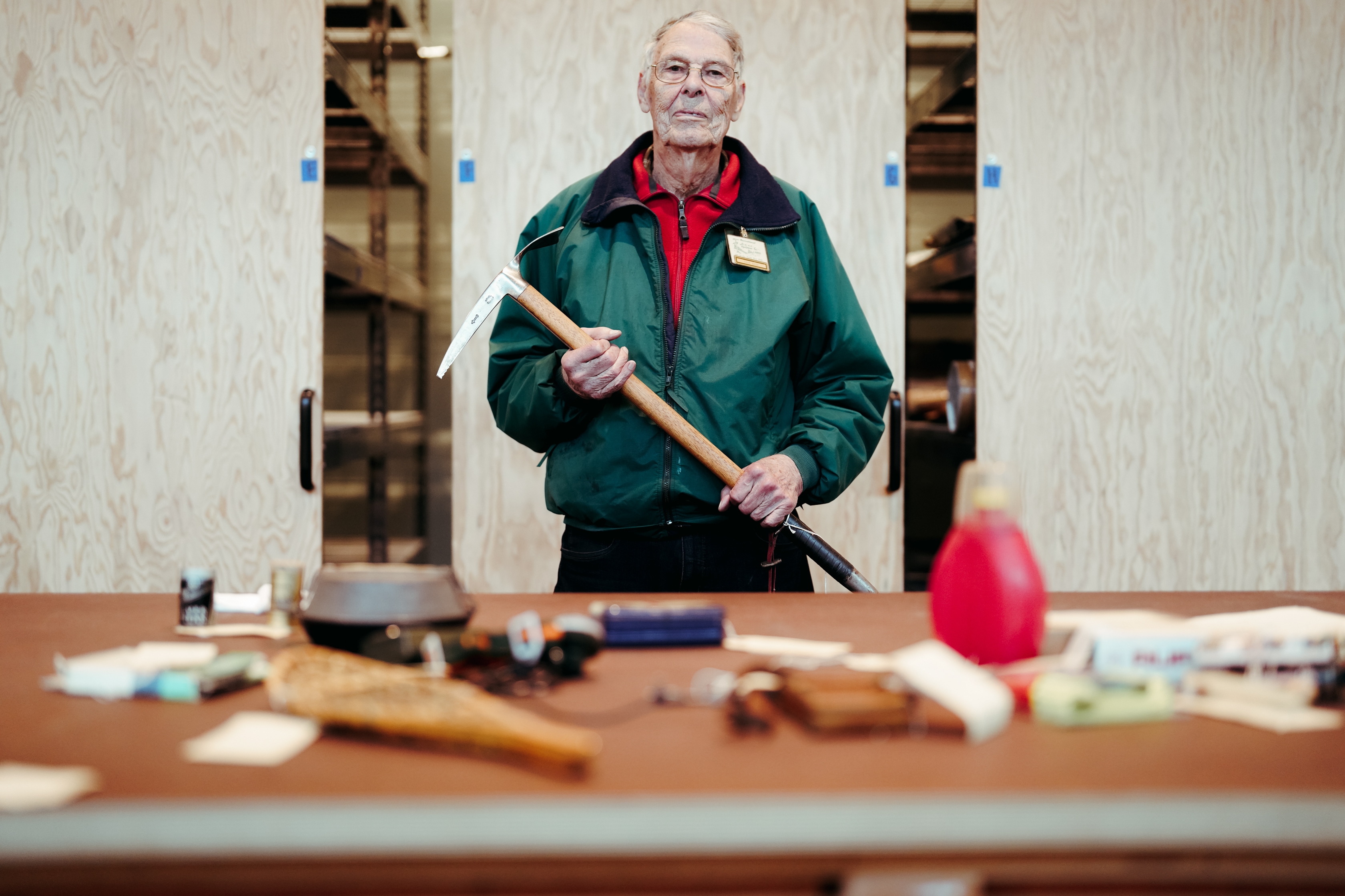 Image of Gary Rose holding his ice axe in the Co-op Living Archive.