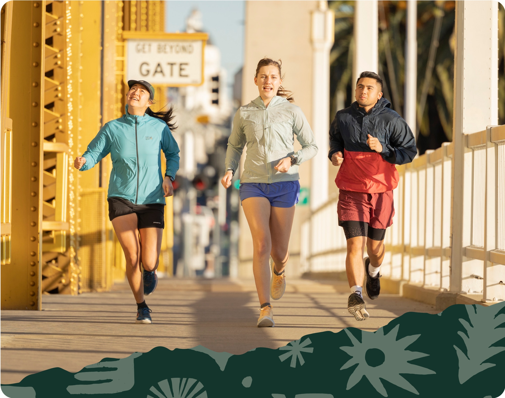 Runners on a city bridge.