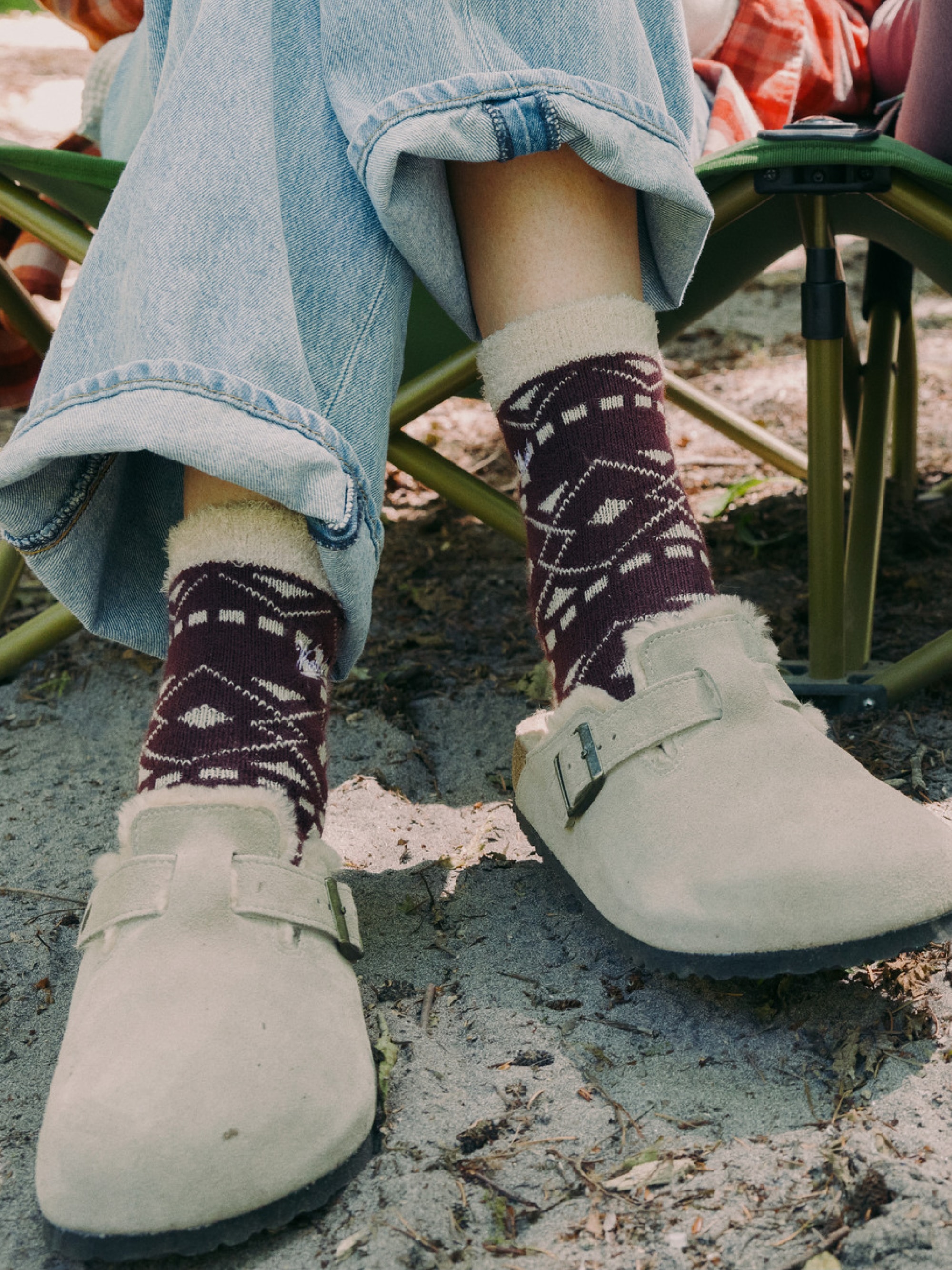 A camper wears Birkenstock Boston shearling clogs.