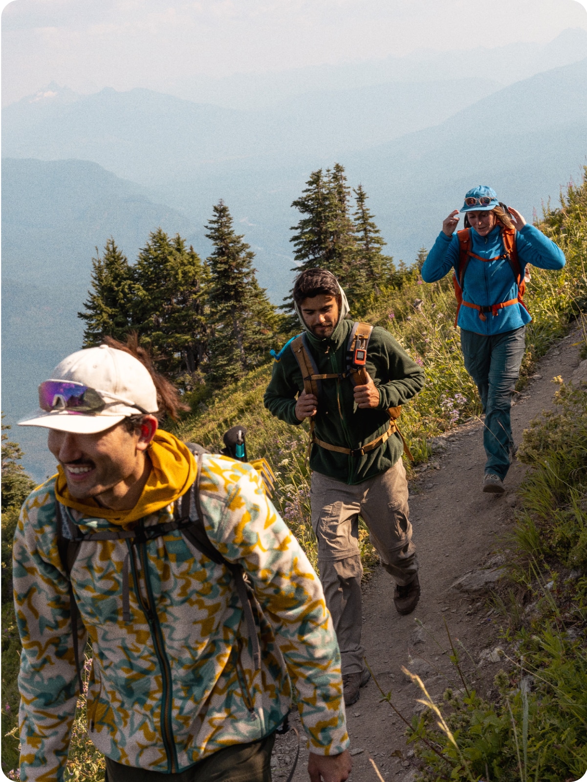 Hikers on a forest trail.