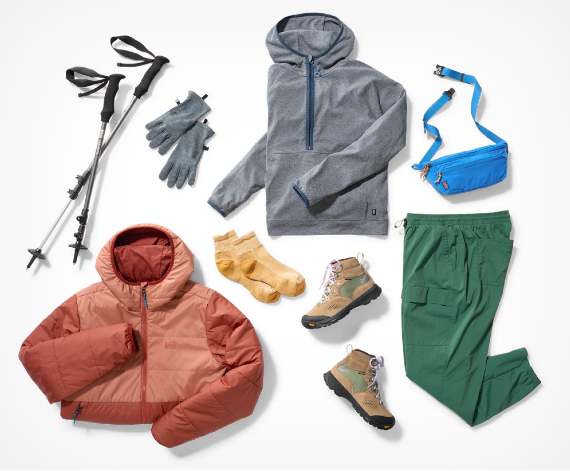 Outdoor gear including trekking poles, jackets, and hiking boots.